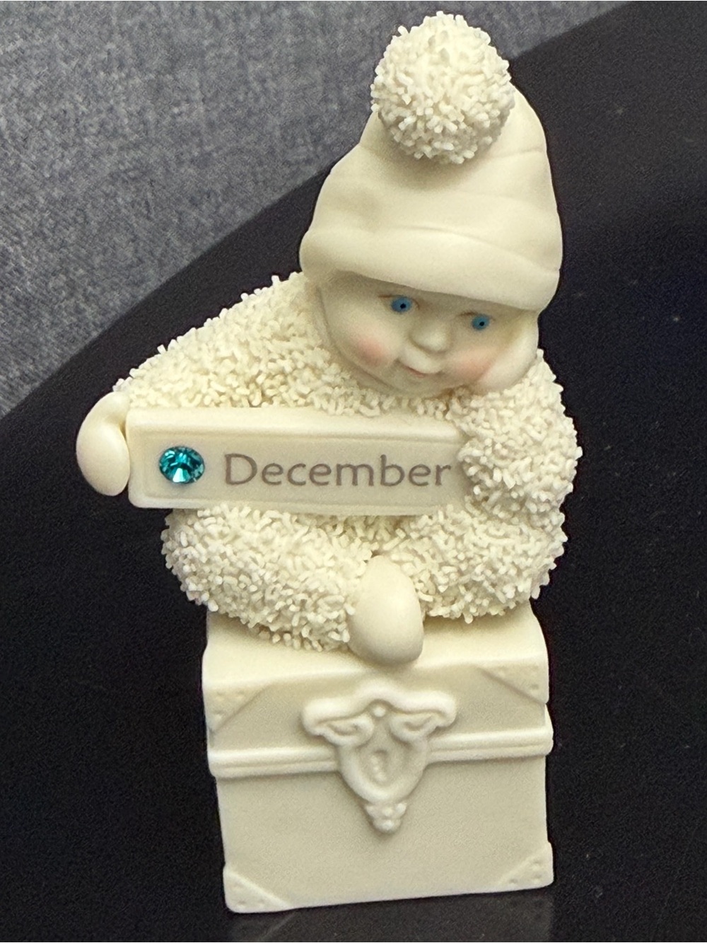 Department 56 Ivory December Baby Figurine with Teal Jewel